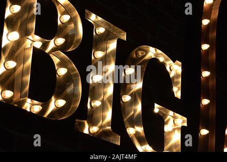 Istanbul Airport / Turkey - November 19 2019 Designer shops and Fast Food stores use bright neon signs and LED displays to tempt travellers Stock Photo