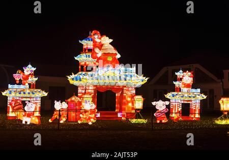 Giant Lantern of China at night. Light festival in Pakruojis Manor, Lithuania. The Year of Pig celebration. Stock Photo