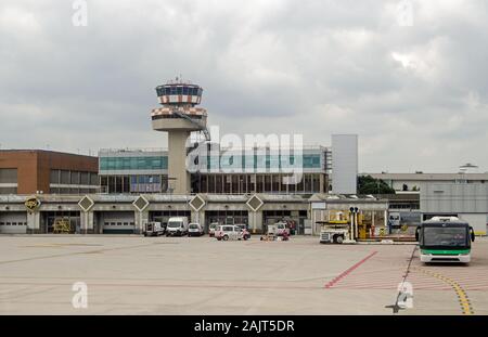 VENICE, ITALY - MAY 22, 2019:  View looking towards the terminal and air traffic control tower of Marco Polo Airport on a cloudy morning in Venice. Stock Photo