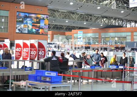 Istanbul Airport / Turkey - November 19 2019 Designer shops and Fast Food stores use bright neon signs and LED displays to tempt travellers Stock Photo