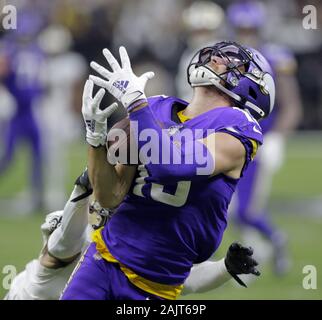 New Orleans, United States. 05th Jan, 2020. Minnesota Vikings wide receiver Adam Thielen (19) snags a 43 yard pass during overtime against the New Orleans Saints during the NFC Wild Card game in New Orleans on January 5, 2020. Defending on the play is New Orleans Saints defensive back Patrick Robinson (21). Photo by AJ Sisco/UPI Credit: UPI/Alamy Live News Stock Photo