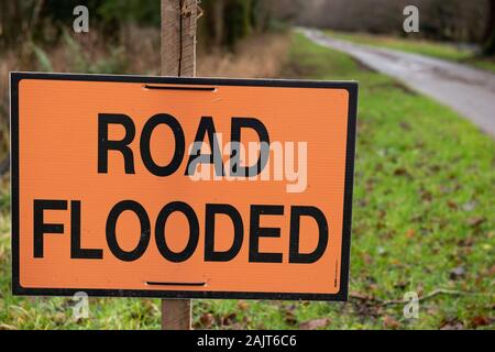 Road flooded notice or information sign by park alley advising or recommending not to go forward in Killarney National Park, County Kerry, Ireland Stock Photo