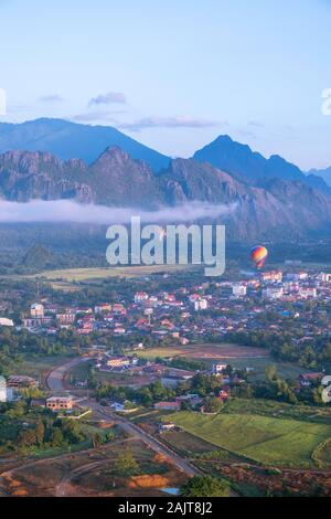 Hot air balloon flight over Vang Vieng, Laos, early in the morning. Stock Photo