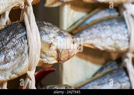 Dried fish hanging up for sale at Gwangjang Market in Seoul, South Korea. Stock Photo