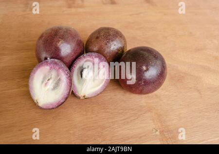 Fresh Ripe Star Apples On Wooden Table Stock Photo