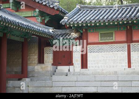 Short doorway in rear of Gyeonghuigung (Gyeonghui Palace or Palace of Serene Harmony), one of the Five Grand Palaces built by the Joseon Dynasty. Stock Photo