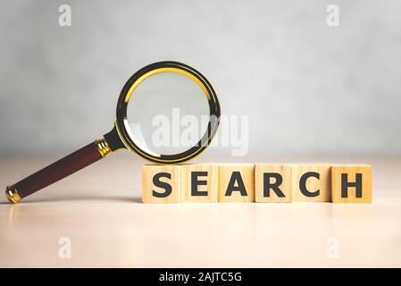 Search - word from wooden blocks with letters, look for information or try to find the answer search concept. Stock Photo