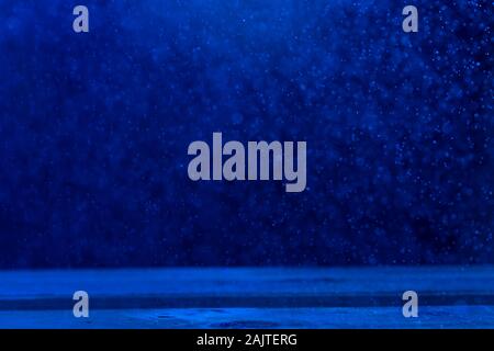 Glittery bokeh of water particles in pantone blue tones Stock Photo