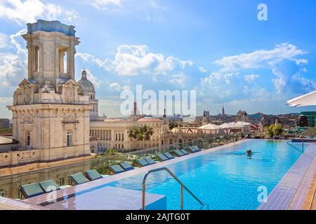 Havana, Cuba – 16 December, 2019: A scenic panoramic view of Havana Historic Center (Havana Vieja) and El Capitolio from the roof terrace of the luxur Stock Photo