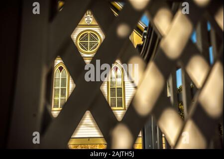 Gothic windows on a church, looking through fence, Council Hill near Galena, Illinois Stock Photo