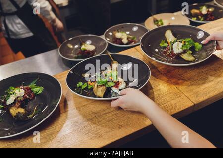 baked eggplants eggplant cooked in the embers on copper plate Stock Photo