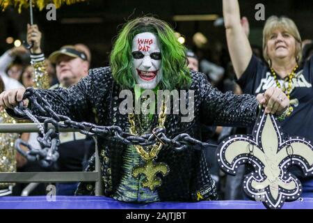 New Orleans Saints fans celebrate as a Carolina Panthers fan gives a thumbs  down sign during an NFL football game, Sunday, Sep. 25, 2022, in Charlotte,  N.C. (AP Photo/Brian Westerholt Stock Photo 