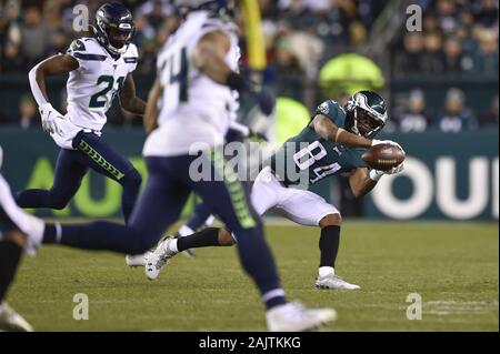 Philadelphia Eagles' Greg Ward (84) scores a two-point conversion against  Baltimore Ravens' Marlon Humphrey (44)