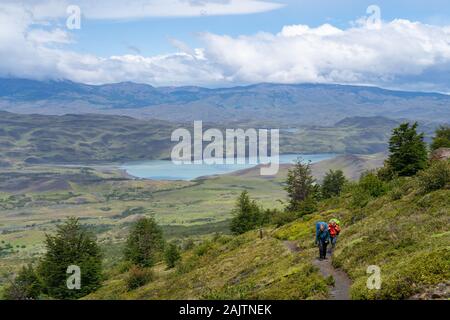 Hikers on the famous W Trek in Torres del Paine National Park in Patagonia, Chile, South America. Stock Photo