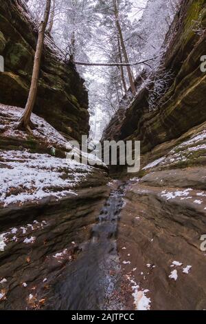 Water flowing down French Canyon on a Winter morning.  Starved Rock State Park, Illinois, USA Stock Photo