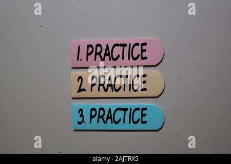 Practice. Practice. Practice write on sticky notes isolated on the tables Stock Photo