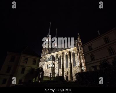 Brno Cathedral of saints peter and paul, seen from the bottow of Petro Hill, at night, surrounded by darkness. Also called katedrala svateho petra a p Stock Photo
