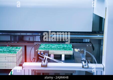 PCB Processing on CNC machine working in factory Stock Photo