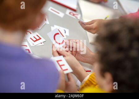 Schoolchildren learning foreign languages during the lesson Stock Photo