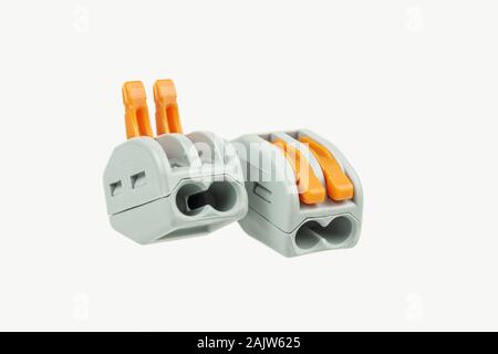 Terminal blocks for connecting wires closeup on a white background. Stock Photo