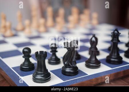 Chess pieces on a chessboard - Focus on the King Stock Photo - Alamy