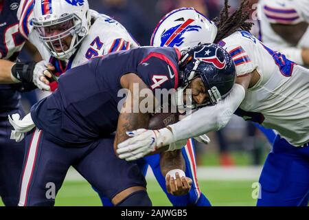 January 4, 2020: Houston Texans quarterback Deshaun Watson (4) is tackled by Buffalo Bills middle linebacker Tremaine Edmunds (49) during the 4th quarter of an NFL football playoff game between the Buffalo Bills and the Houston Texans at NRG Stadium in Houston, TX. The Texans won 22 to 19 in overtime.Trask Smith/CSM Stock Photo