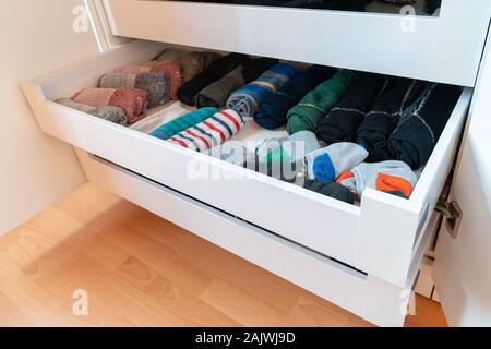 Many Colorful Men S Socks In A Plain White Wooden Sock Drawer In A