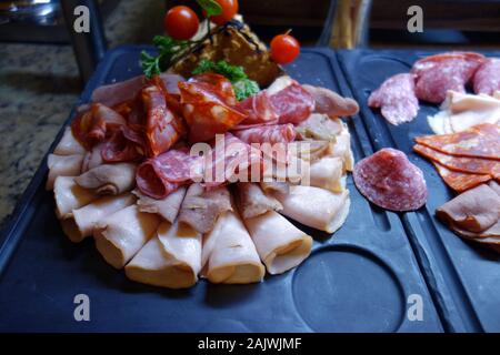 Various Sliced Processed Cold Meats on Display in the Buffet at the Azul Beach Resort Hotel, Puerto Morelos, Riviera Maya, Cancun, Mexico. Stock Photo