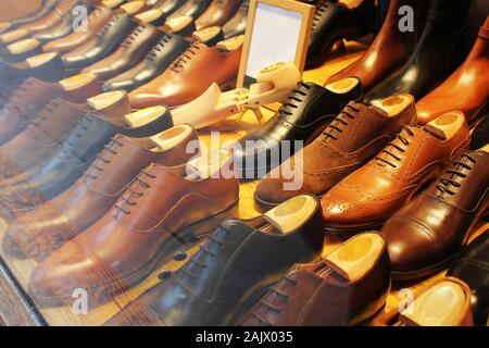 Luxury leather men shoes in the shop Stock Photo