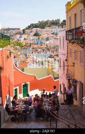 LISBON, PORTUGAL - SEPTEMBER 13, 2019: Outdoor cafe on the old streets of Alfama, overlooking Baixa Stock Photo