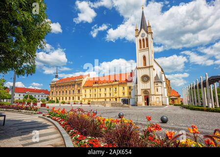 Keszthely city, Hungary, a popular resort on lake Balaton, view of the historical Old town, central square and the Our Lady of Hungary church on a bea Stock Photo