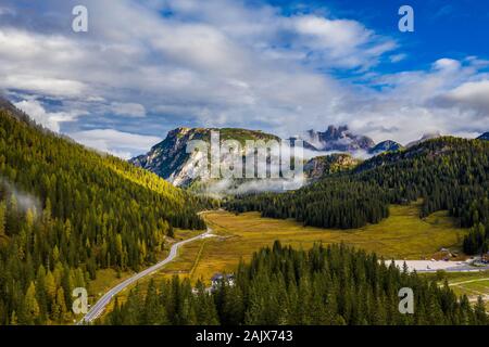 Scenic aerial view of a winding trekking path in a forest. Trekking path in the forest from above, drone view. Aerial top view of a trail in the middl Stock Photo