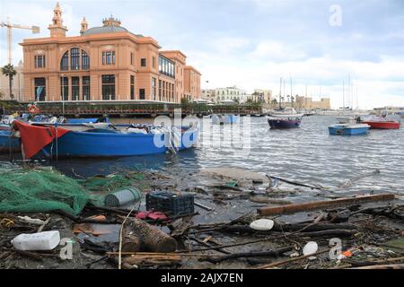 Plastic and microplastic waste and garbage floating in the water with fishing net. Ocean and sea plastic pollution Stock Photo