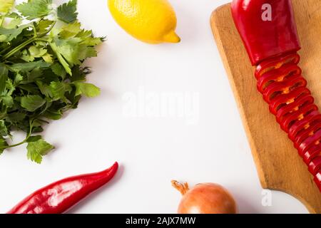 green celery, bell peppers, onions and lemon and centered copy space Stock Photo