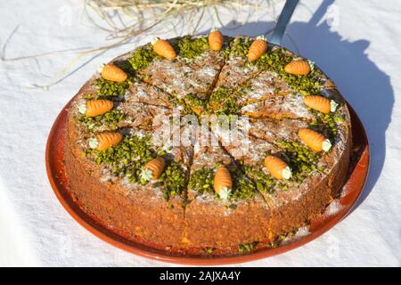 carrot cake on a table with white tablecloth Stock Photo