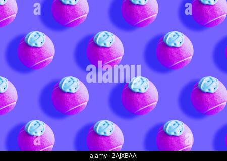 Tennis ball pattern with blue paint on purple Stock Photo