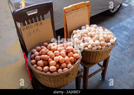 Two baskets of eggs at a market in Xiamen (Amoy), China. Stock Photo