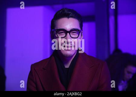 Chinese actor Hu Bing on the front row of Feng Chen Wang London Fashion Week Men's AW20 show held at Ambika P3, London. Stock Photo