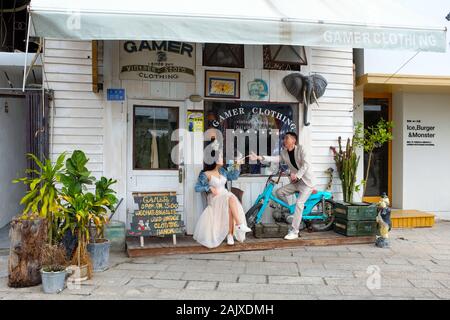 A couple taking part in a wedding shoot in Shapowei, Xiamen (Amoy), China. Stock Photo