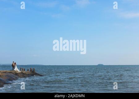A couple taking part in a wedding shoot in Xiamen (Amoy), China. Stock Photo