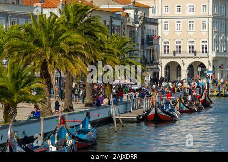 Tourists on the traditional Moliceiro boats on the central canal in Aveiro Portugal Stock Photo