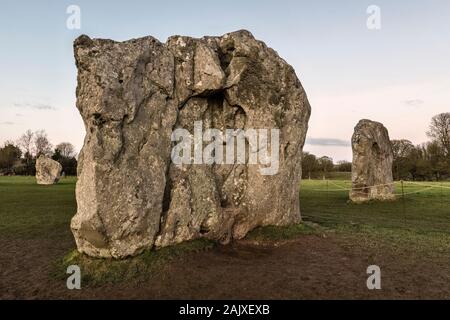 Avebury, Wiltshire, a vast Neolithic henge monument built around 3000 BC. The two portal stones marking the entrance, and part of the inner circle Stock Photo