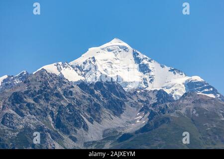 Mount Tetnuldi rises above the Great Caucasian Range in the upper Svaneti Stock Photo