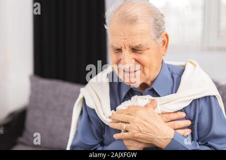 Senior man have a heart attack. Senior man is having pain in his chest.Heart attack symptoms Stock Photo
