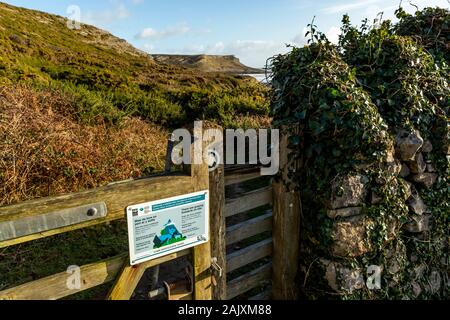 Nature reserve gate and stile at Overton Mere and Cliff. Port Eynon, Gower Peninsula, Wales Stock Photo