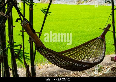 Hammock swing  Made from bamboo in garden. Stock Photo