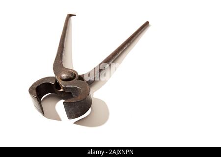 Old rusty pincers isolated on white. Vintage tool. Squeeze concept. Copy space Stock Photo