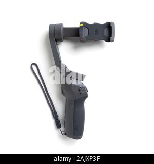 Chekhov, Russia - December 7, 2019: DJI Osmo Mobile 3 isolated on white background. Stabilizer for smartphone. Stock Photo