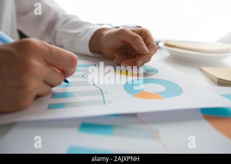 Hands of financial analyst work with chart report. Statistics, accounting business person. Stock Photo