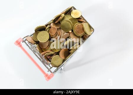 Top View of Tiny Shopping Trolley Full of Euro Coins on White Stock Photo